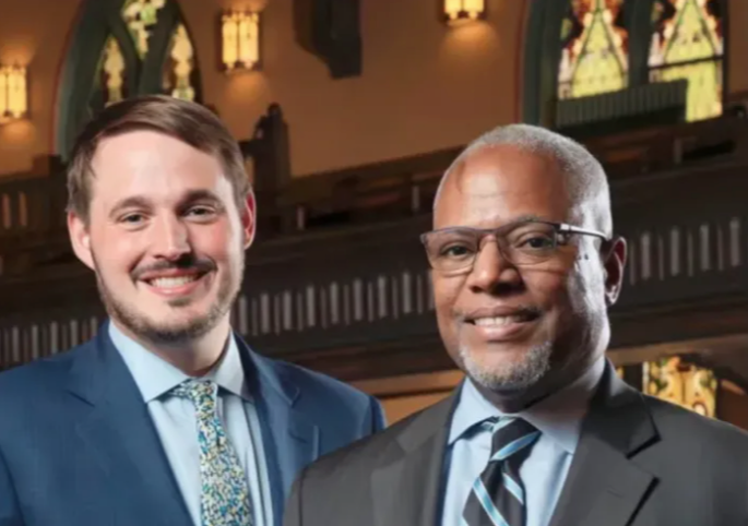 The Rev. Michael Woolf (left) and the Rev. Michael Nabors, recipients of the Edwin T. Dahlberg Peace and Justice Award, stand together at Lake Street Church on Sunday. Woolf is pastor of Lake Street Church and Nabors is pastor of Second Baptist Church. Credit: Chris Walker
